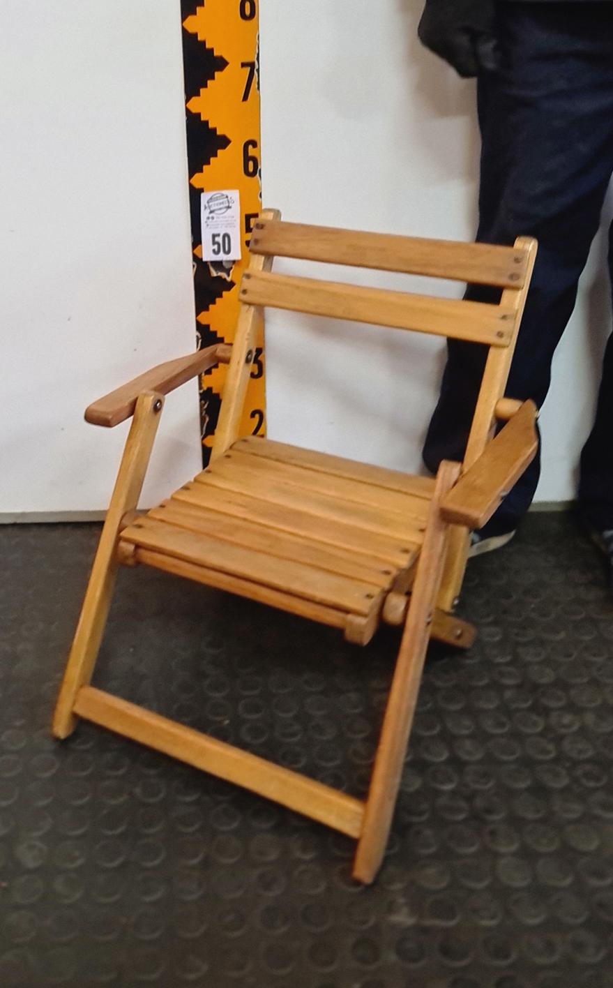 50.  Wooden child’s folding chair